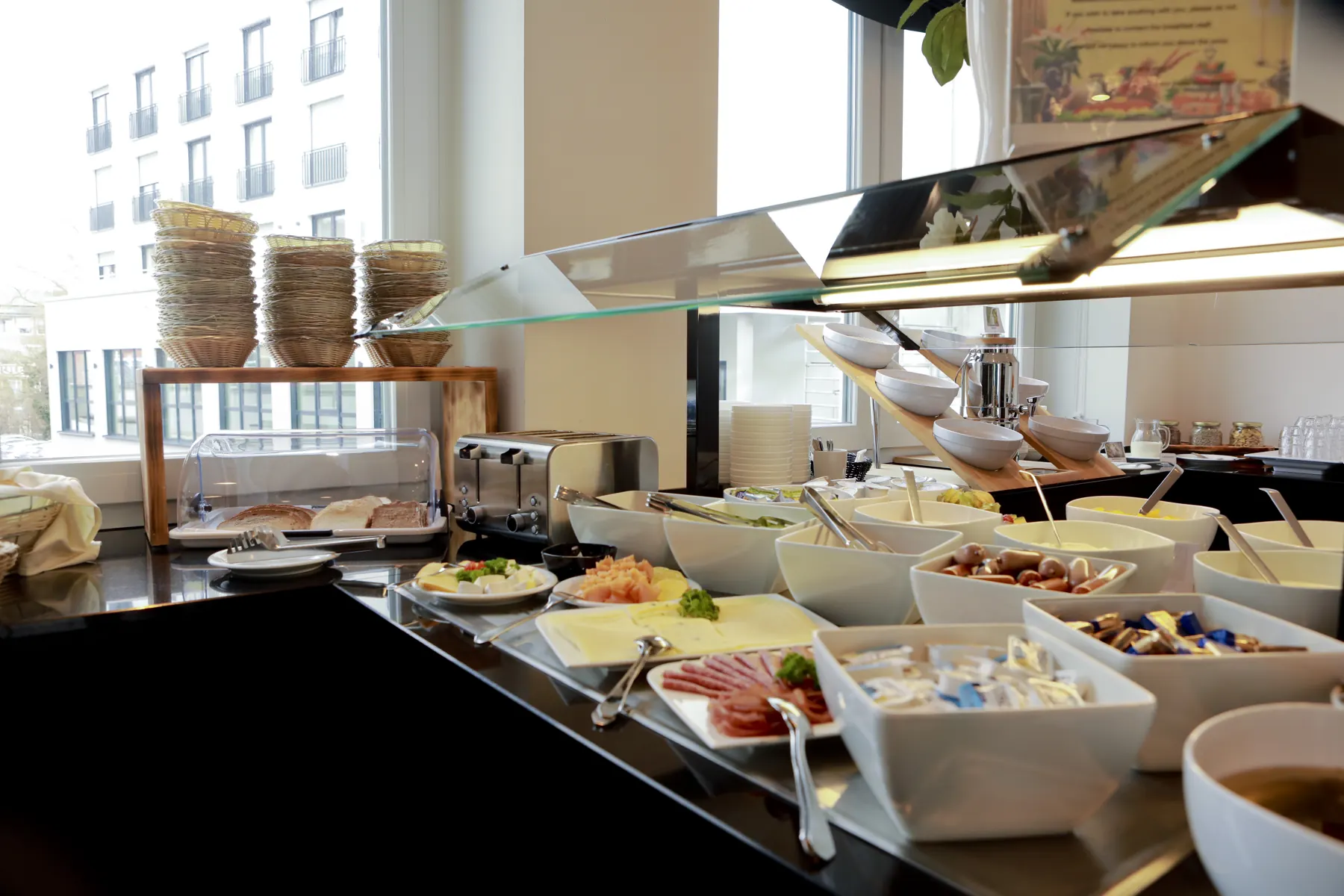Breakfast buffet with cold cuts and fruit