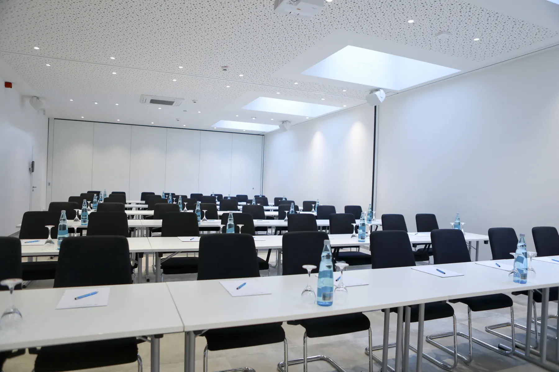 Meeting room with classroom seating and skylights