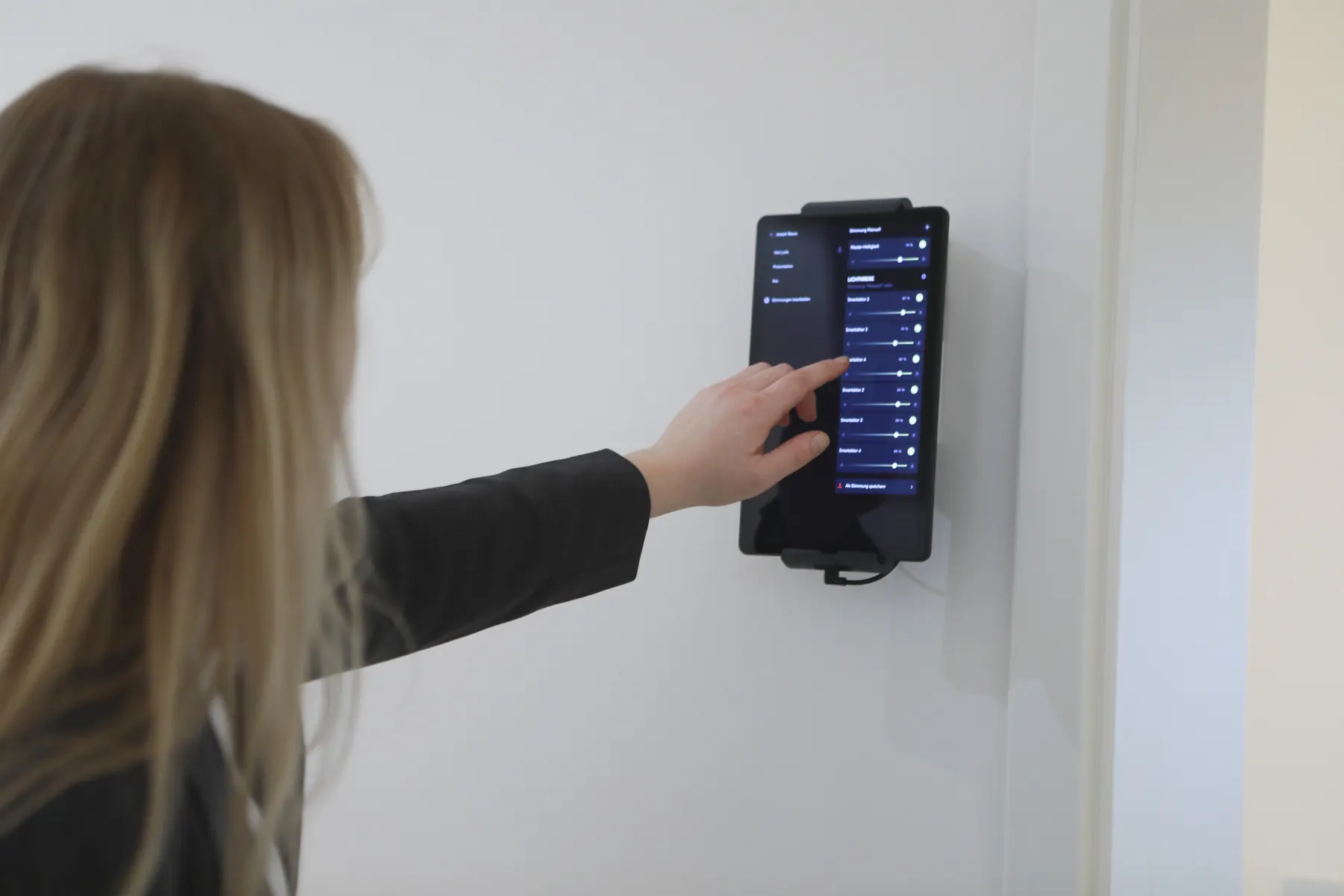 Control panel for the room technology on the wall of a meeting room